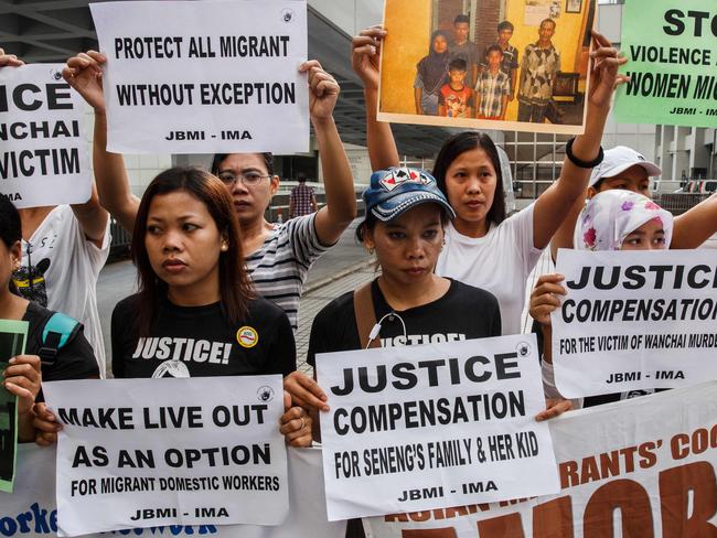 A group of protesters from Indonesian migrant worker organisations outside the High Court on the first day of Hong Kong’s biggest murder case in years. Picture: AFP PHOTO / Anthony WALLACE