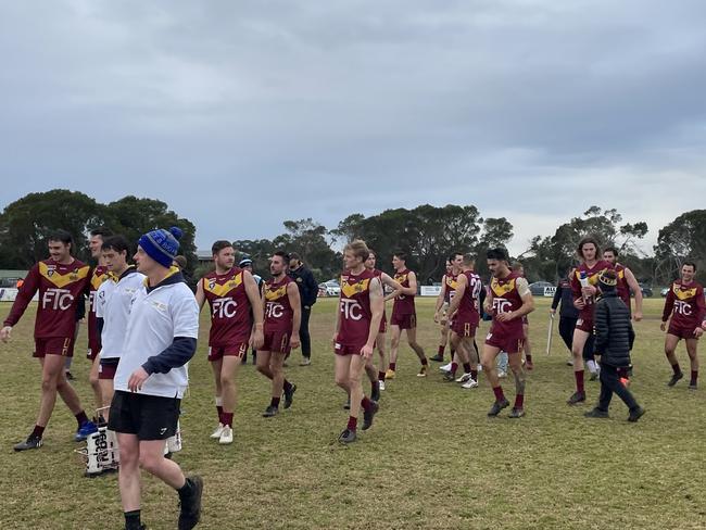 Tyabb players celebrate their stirring victory.