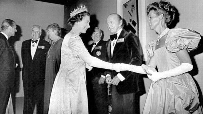 Queen Elizabeth II shakes hands with Lady Sonia McMahon and Sir William McMahon at a reception in Canberra in 1982.