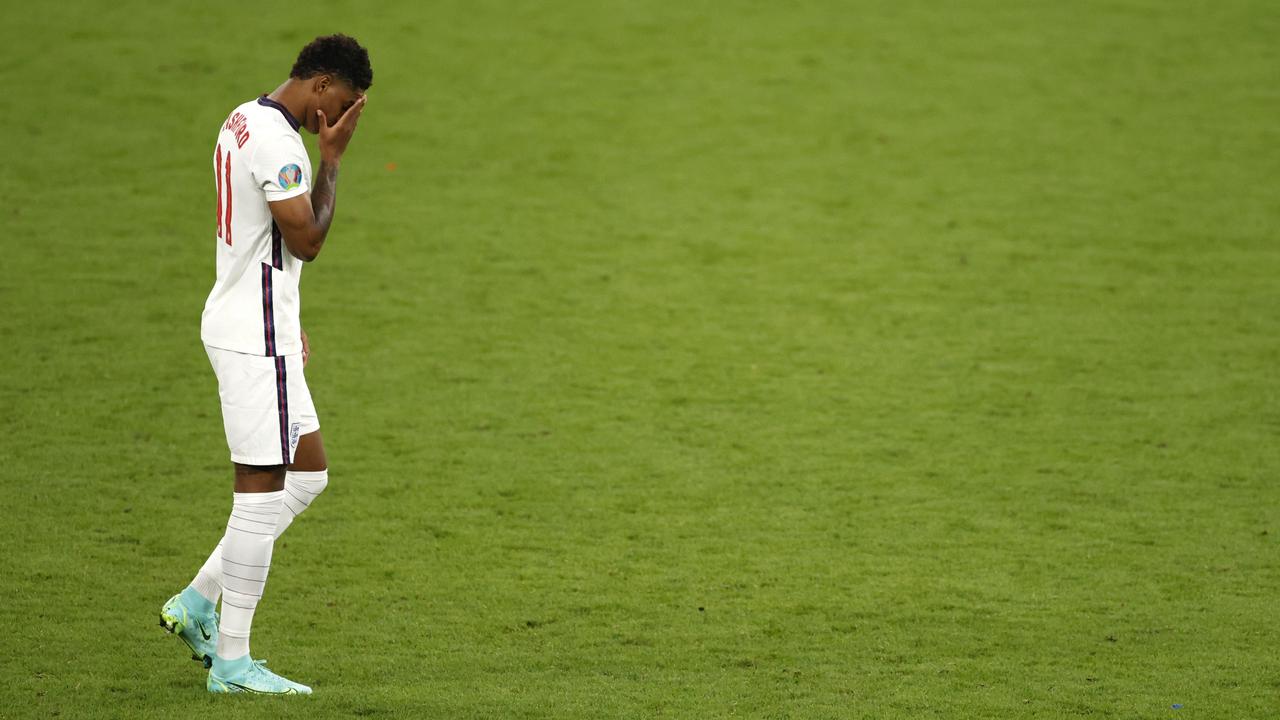 LONDON, ENGLAND - JULY 11: Marcus Rashford of England reacts after missing their team's third penalty in the penalty shoot out during the UEFA Euro 2020 Championship Final between Italy and England at Wembley Stadium on July 11, 2021 in London, England. (Photo by John Sibley - Pool/Getty Images)