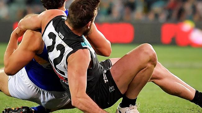 Port Adelaide’s Charlie Dixon falls awkwardly during the round 21 AFL clash against West Coast Eagles at Adelaide Oval, breaking his leg in two places. Picture: Daniel Kalisz/Getty Images.