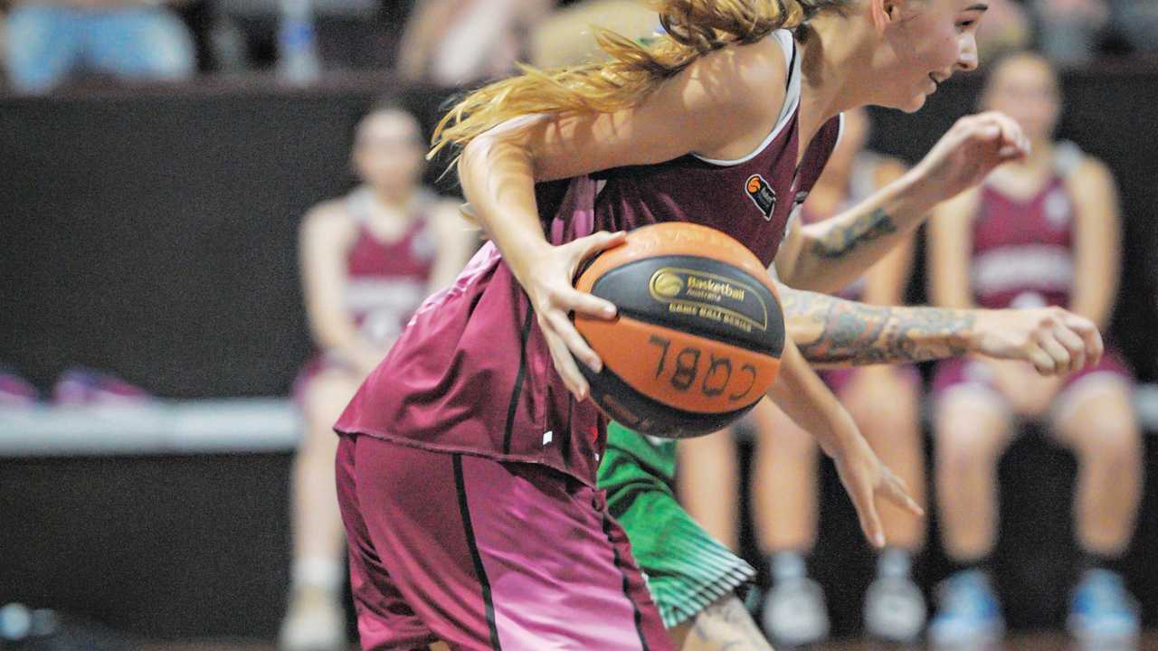 GAME ON: Mekkija Redgard dribbles the ball down the court for Bundaberg. Picture: Brian Cassidy