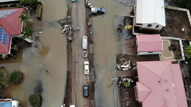 The small township of Coraki, south of Lismore has opened up to some roads again after being cut off by flood waters for most of the week with some homes along Martin St still under water. Picture: Toby Zerna