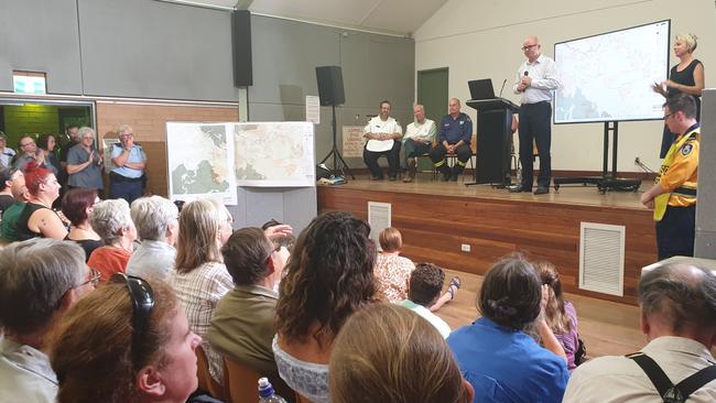 Mayor Mark Greenhill addresses residents at the first of two community fire meetings held in the Mid Mountains Neighbourhood Centre last night. To his right is an Auslan interpreter. Picture: Isabell Petrinic