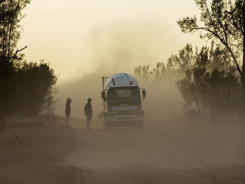 Stuart Lelievre is met by wife Gabbie and son Nicholas, 15, as he delivers food to his sheep in a cement mixer on January 16, 2019 in Louth, Australia. Stuart, Gabby and their boys, feed all of their sheep due to dire drought conditions. The feeding is time consuming and a financial burden and they are dealing with issues of physical and emotional exhaustion as a result. Apart from the ongoing drought, Gabbie is outraged that her boys don't have access to clean water for showers. She likens it to a third world country. Local communities in the Darling River area are facing drought and clean water shortages as debate grows over the alleged mismanagement of the Murray-Darling Basin. Recent mass kills of hundreds of thousands of fish in the Darling river have raised serious questions about the way WaterNSW is managing the lakes system, and calls for a royal commission. (Photo by Jenny Evans/Getty Images)