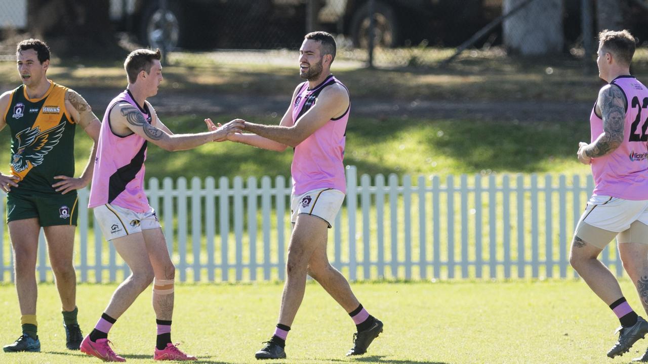 Rohan Drummond (centre) celebrates a goal for Toowoomba Tigers. Picture: Kevin Farmer