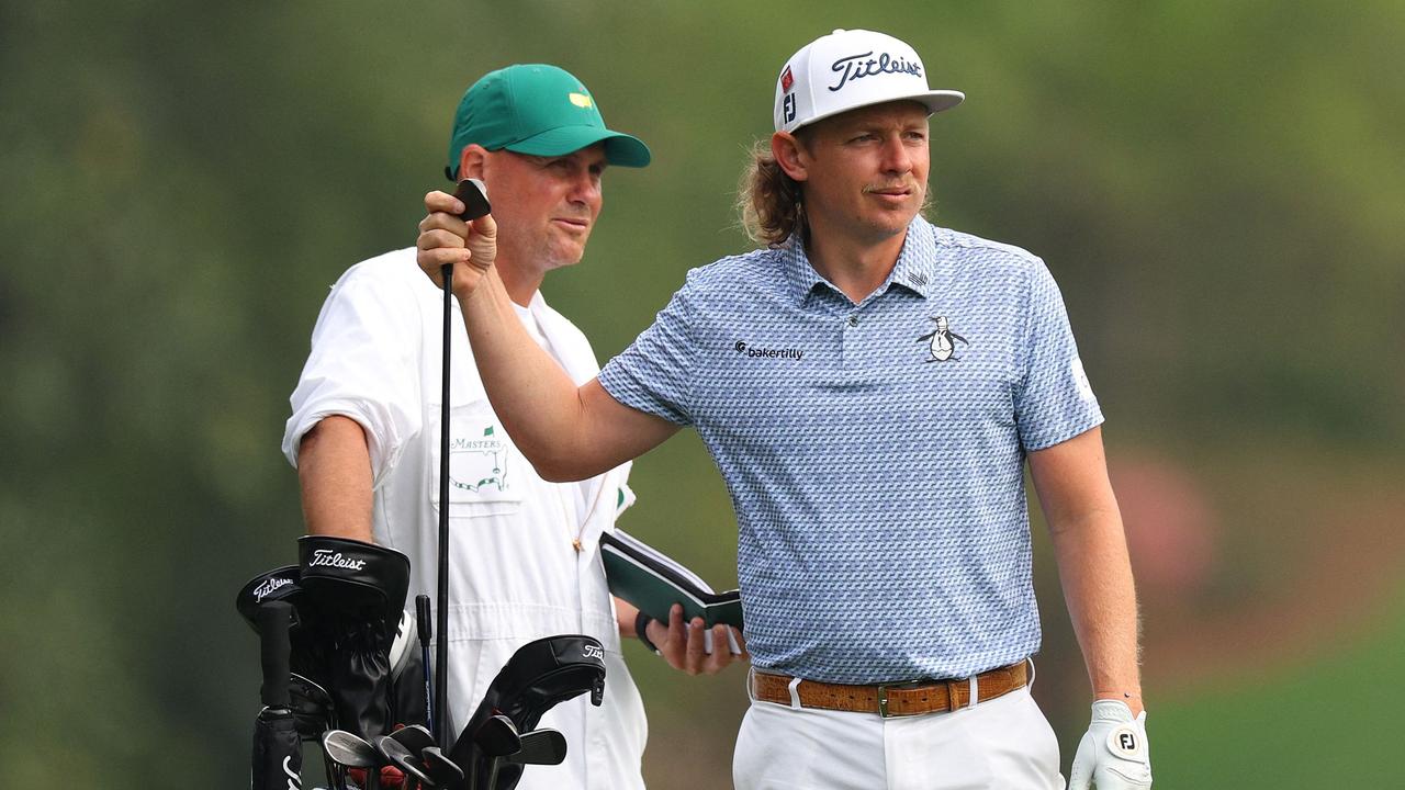 Cameron Smith of Australia talks with his caddie Sam Pinfold. Picture: Andrew Redington/Getty Images/AFP
