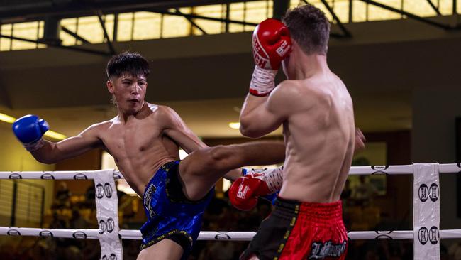 Jaiden Bartley (blue) vs. Ivor Peeters (red) at the NT Fight Series XI at Ventia Stadium. Picture: Pema Tamang Pakhrin