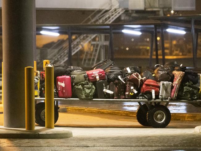 Evacuees’ luggage is transferred at Perth Airport. Picture: Getty Images