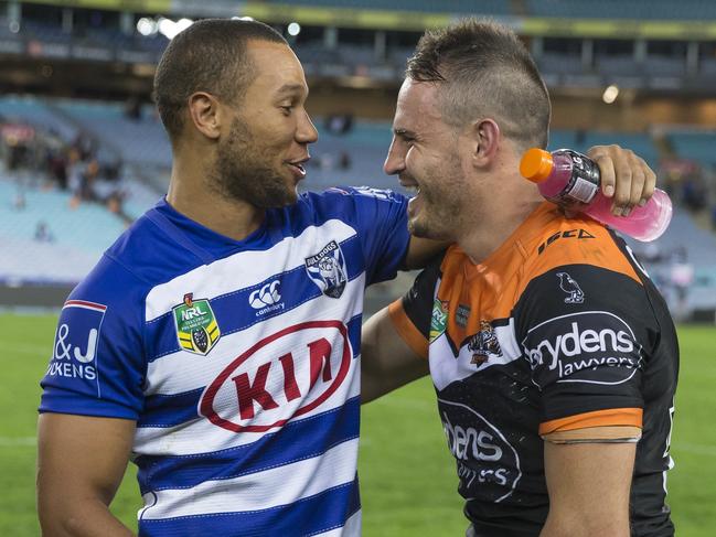 Moses Mbye and Josh Reynolds share a laugh at the end of the match.