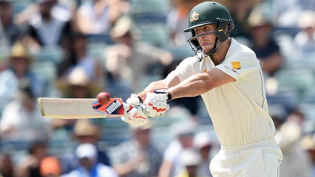 Australian batsman Mitchell Marsh hits to the boundary for four runs from the bowling of New Zealand's Trent Boult on day 2 of the second Trans-Tasman Test match between Australia and New Zealand at the WACA ground in Perth , Saturday, Nov. 14, 2015. (AAP Image/Dave Hunt) NO ARCHIVING, EDITORIAL USE ONLY, IMAGES TO BE USED FOR NEWS REPORTING PURPOSES ONLY, NO COMMERCIAL USE WHATSOEVER, NO USE IN BOOKS WITHOUT PRIOR WRITTEN CONSENT FROM AAP