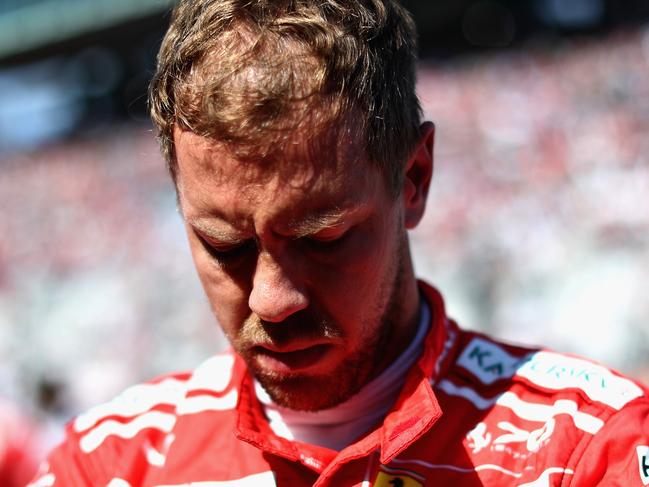 SUZUKA, JAPAN - OCTOBER 08:  Sebastian Vettel of Germany and Ferrari prepares to drive on the grid before the Formula One Grand Prix of Japan at Suzuka Circuit on October 8, 2017 in Suzuka.  (Photo by Lars Baron/Getty Images)