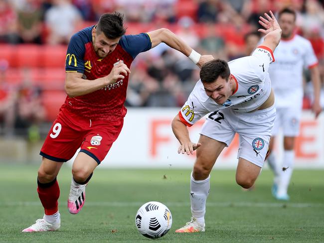 ADELAIDE, AUSTRALIA - JANUARY 03: Tomi Juric of Adelaide United competes with Curtis Good of Melbourne City during the A-League match between Adelaide United and Melbourne City at Coopers Stadium, on January 03, 2021, in Adelaide, Australia. (Photo by Mark Brake/Getty Images)