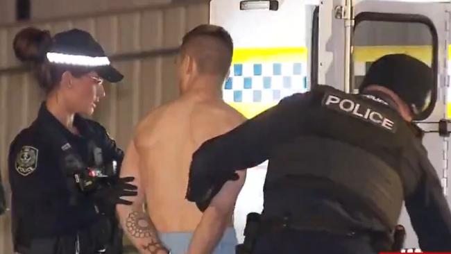 The man is arrested at the scene after a stabbing at a Tea Tree Gully home on Monday, April 29, 2024. Picture: 7NEWS