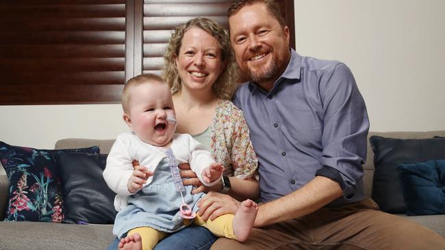 Christie and Brad Rea with their daughter Imogen, 16 months, who is undergoing chemotherapy. Picture: David Swift