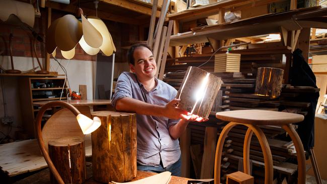 Furniture and lighting designer/maker Duncan Meerding with some of his work at his workshop in Hobart, Tasmania. Pic — Peter Mathew