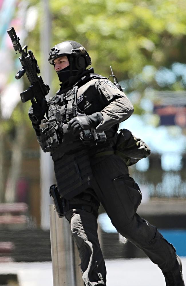 Elite squad … An armed police officer in action during yesterday’s standoff. Picture: AP Photo/Rob Griffith