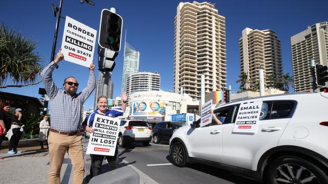 Greg Daven from Hot Air Balloon Cairns and Gold Coast and Sarah Colgate from Aquaduck cheer on the convoy. Picture: Glenn Hampson.