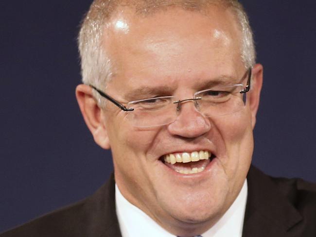 In this  May 19, 2019, file photo, Australian Prime Minister Scott Morrison speaks to party supporters flanked by his wife, Jenny, second from left, and daughters Lily, right, and Abbey, after his opponent concedes in the federal election in Sydney, Australia. Australiaâ€™s newly reelected administration says its promise to slash income taxes might be delivered late but wonâ€™t be broken as the government hopes to stimulate consumer spending and revive a flagging economy. (AP Photo/Rick Rycroft, File)