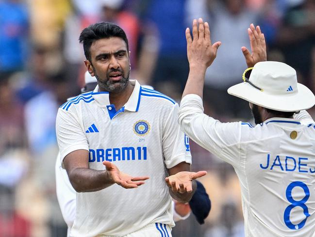 India's Ravichandran Ashwin (L) celebrates a wicket with Ravi Jadeja.