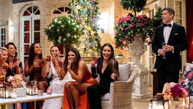 Host Osher Günsberg with some of the women trying to win Jimmy Nicholson's heart early in the season. Picture: Ten/Bachelor