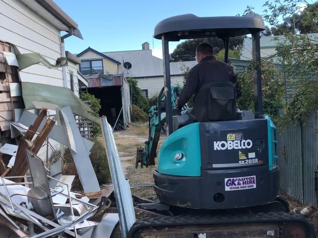 Screenshots of Malcolm Taylor, filmed by his brother Garry, pushing a water tank down the streets of Murtoa. The brothers unleashed a "tirade of destruction" on the family home that they share with their sister amid a feud about the estate. Pics from Victoria County Court March, 2018.