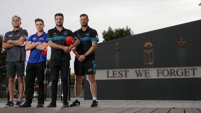 Mernda coach Paul Derrick and captain Anthony Bradford with Laurimar captain Mitch Thompson and coach Justin Sherman. Picture: George Salpigtidis