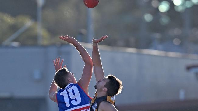 Keilor’s Blair Wyllie and Strathmore’s Andrew Vavra do battle in the ruck. Picture: Andy Brownbill