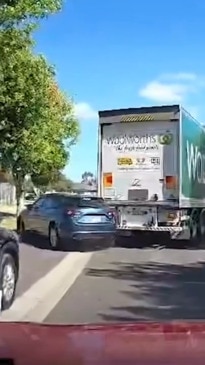 Dashcam shows the moment Woolies truck drives off with car