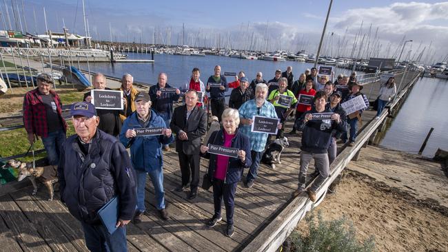 John Burton (front) with boaters and community members who have banded together to try and save the pier. Picture: WAYNE TAYLOR