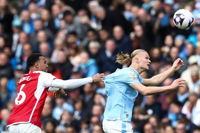 Arsenal must stop an in-form Erling Haaland (right) as the Premier League's top two face off on Sunday