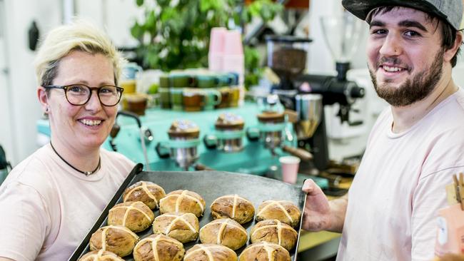 TASSIE LIVING: Jess Mackeen Head Baker and Sam Saunders baker at Baked Gluten Free, Moonah with their Hot Happy Buns.Picture: EDDIE SAFARIK