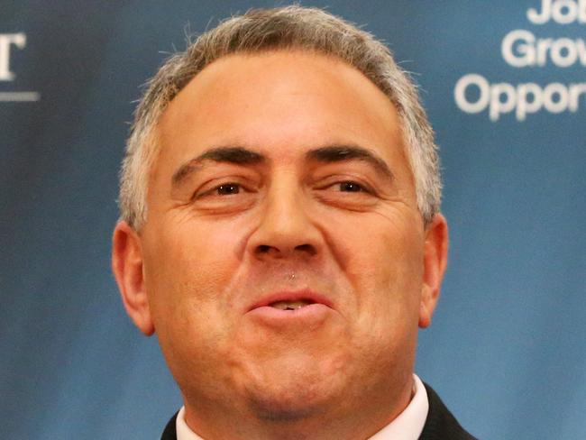 Treasurer Joe Hockey, accompanied by Finance Minister Mathias Cormann, sells his budget at this evening's media conference in the Budget 2015 Lockup at Parliament House in Canberra.