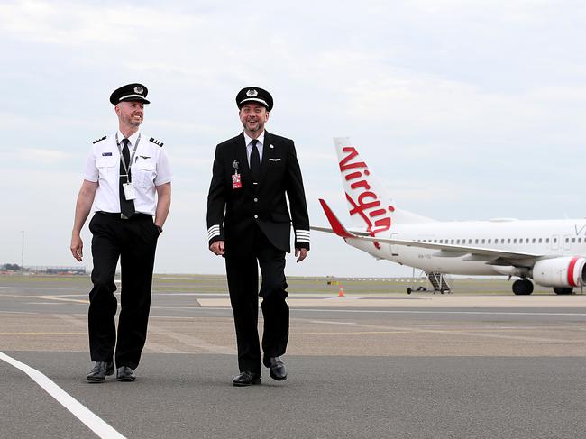 Virgin Australia Pilots (L-R) First Officer Craig Chapman and Captain Robert Ricketts are looking forward to doing some more flying after easing of NSW-VIC border restrictions.  Jane Dempster/The Australian.