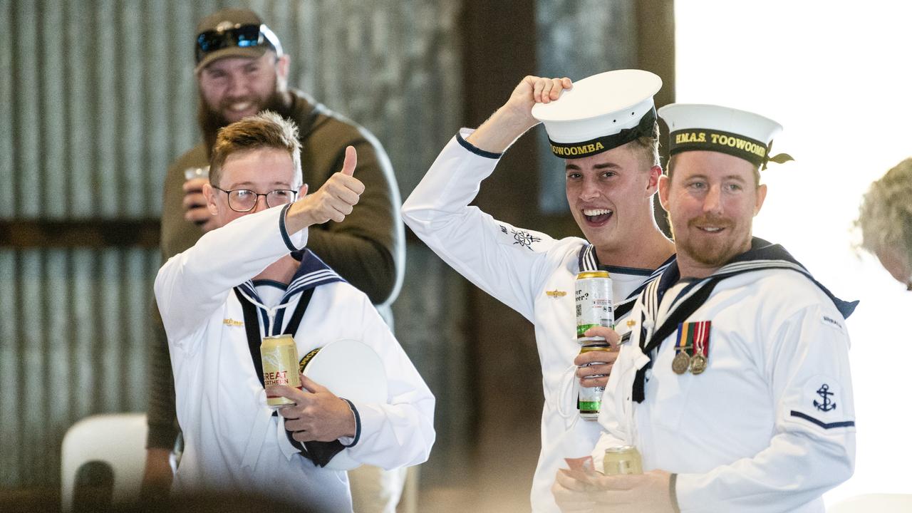 Reacting during two-up are (from left) Daniel Raggatt, Shaun Siltic and Brendan Shanks in the Goods Shed as part of Toowoomba Anzac Day commemorations, Monday, April 25, 2022. Picture: Kevin Farmer