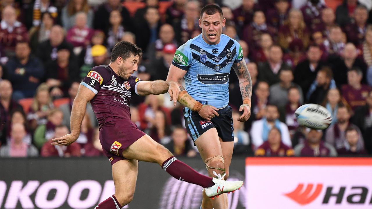 Ben Hunt of the Maroons kicks out of dummy half