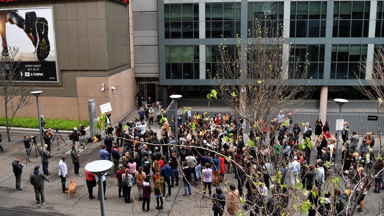 ABC staff exit their offices ahead of a meeting in Ultimo, Sydney.