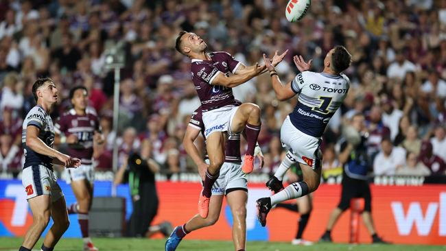 Luke Brooks of the Sea Eagles and Scott Drinkwater of the Cowboys compete for the ball during the round one NRL match between Manly Sea Eagles and North Queensland Cowboys at 4 Pines Park, on March 08, 2025, in Sydney, Australia. (Photo by Cameron Spencer/Getty Images)