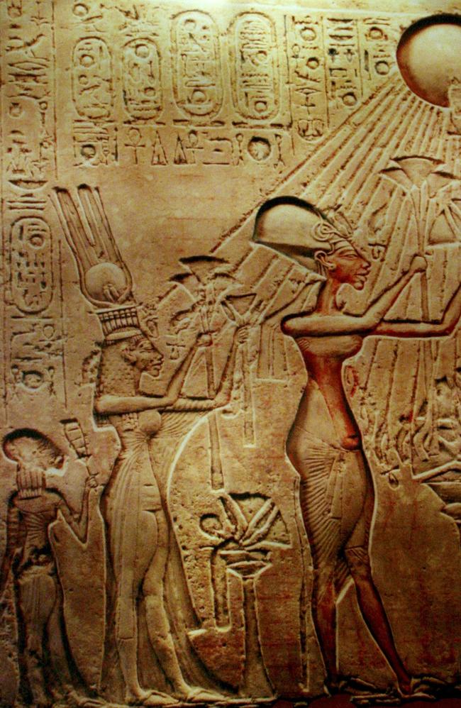 A stela at the Egyptian museum in Cairo showing Pharaoh Akhenaten, his Queen Nefertiti and their children worshipping the sun in the more natural artistic style of the time. Picture: AP