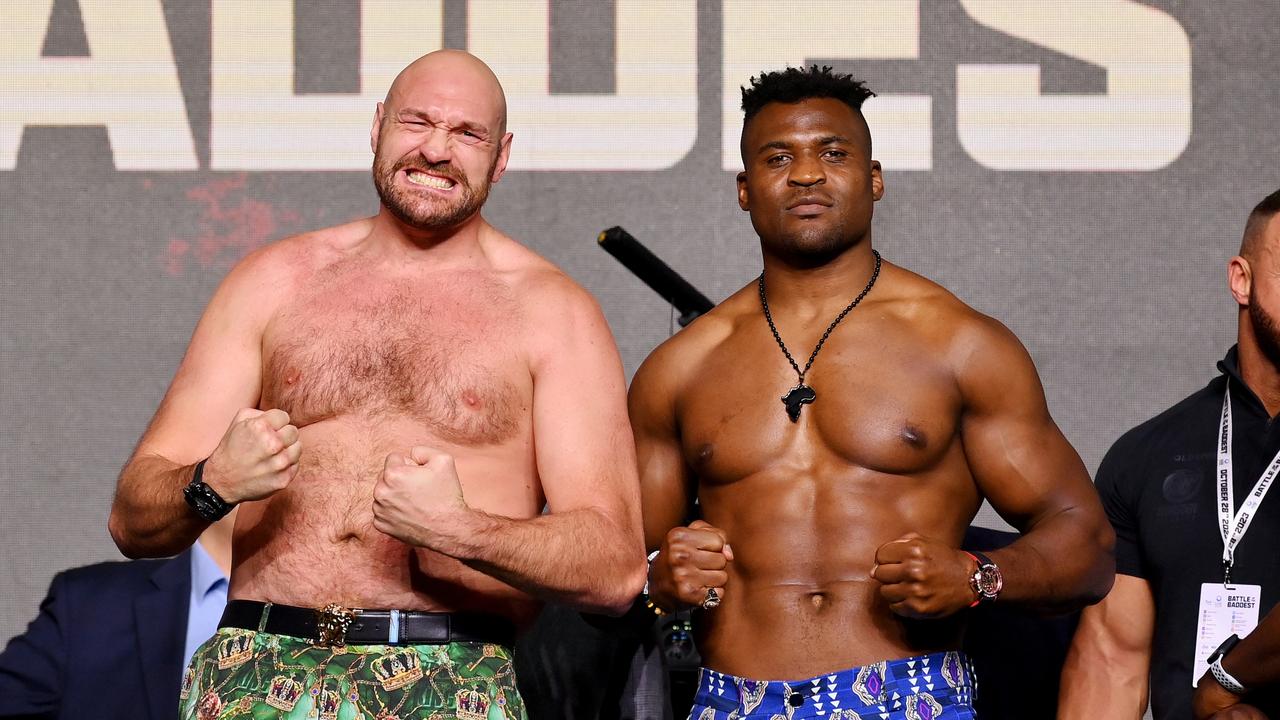 RIYADH, SAUDI ARABIA - OCTOBER 26: Tyson Fury and Francis Ngannou react in the face off during a press conference ahead of the Tyson Fury v Francis Ngannou boxing match at Boulevard Hall on October 26, 2023 in Riyadh, Saudi Arabia. (Photo by Justin Setterfield/Getty Images)