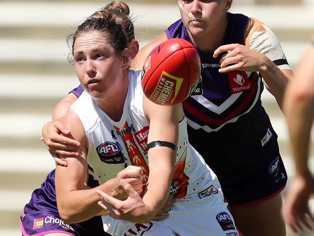 Giant Jodie Hicks fires out a handball. Picture: Will Russell/AFL Photos via Getty Images