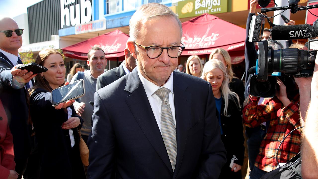 Labor leader Anthony Albanese walks away from a quick press conference after apologising for not knowing the national unemployment rate or the official cash rate in an earlier press conference. Picture: Toby Zerna