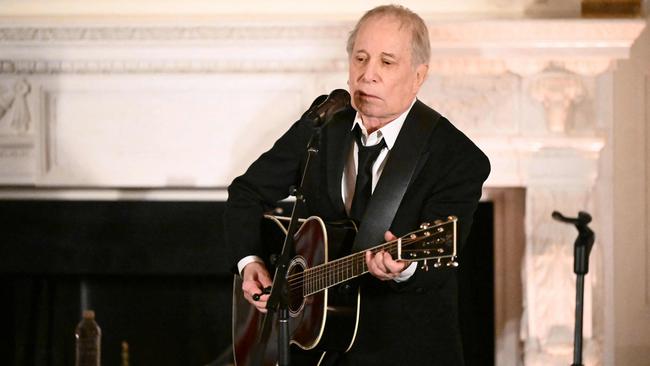 Paul Simon performs his hit Graceland at the reception. Picture: AFP