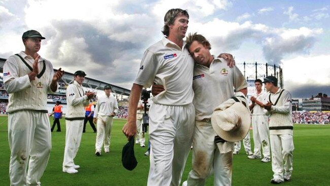 Glenn McGrath (left) and Shane Warne embrace in 2005 as they leave the field for the last time in an Ashes series in England. Picture: Phil Hillyard.