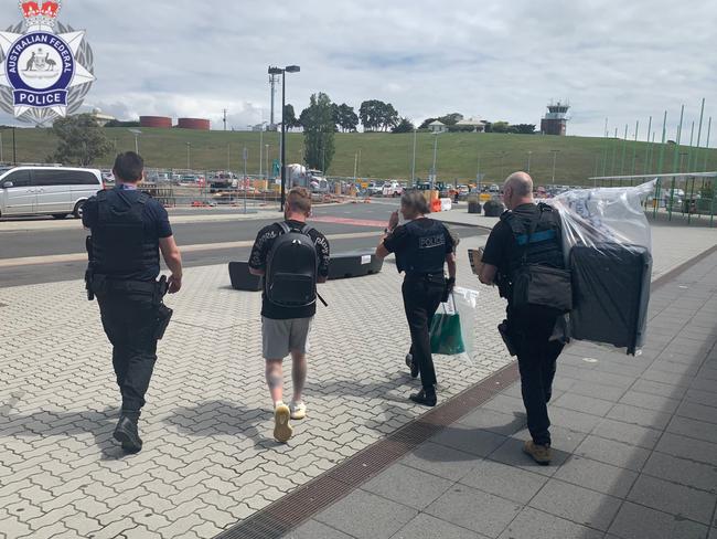 A 38-year-old Alexandria man being arrested at Hobart Airport on Thursday, November 9, 2023. Picture: AFP/ Tasmania Police