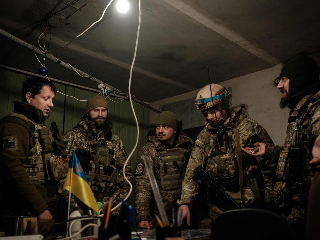 Ukrainian servicemen of the State Border Guard Service in the operations room in Bakhmut. Picture: AFP