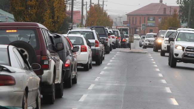 The exodus from Longford, 10 minutes before the levee gates close. Picture: BRUCE MOUNSTER