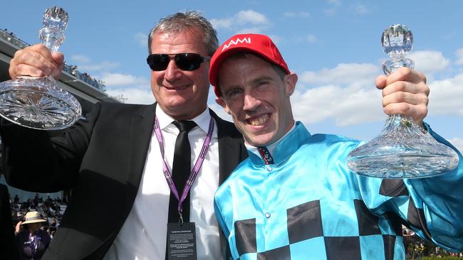 John Allen celebrating Extra Brut’s Victoria Derby victory with Darren Weir. Picture: AAP