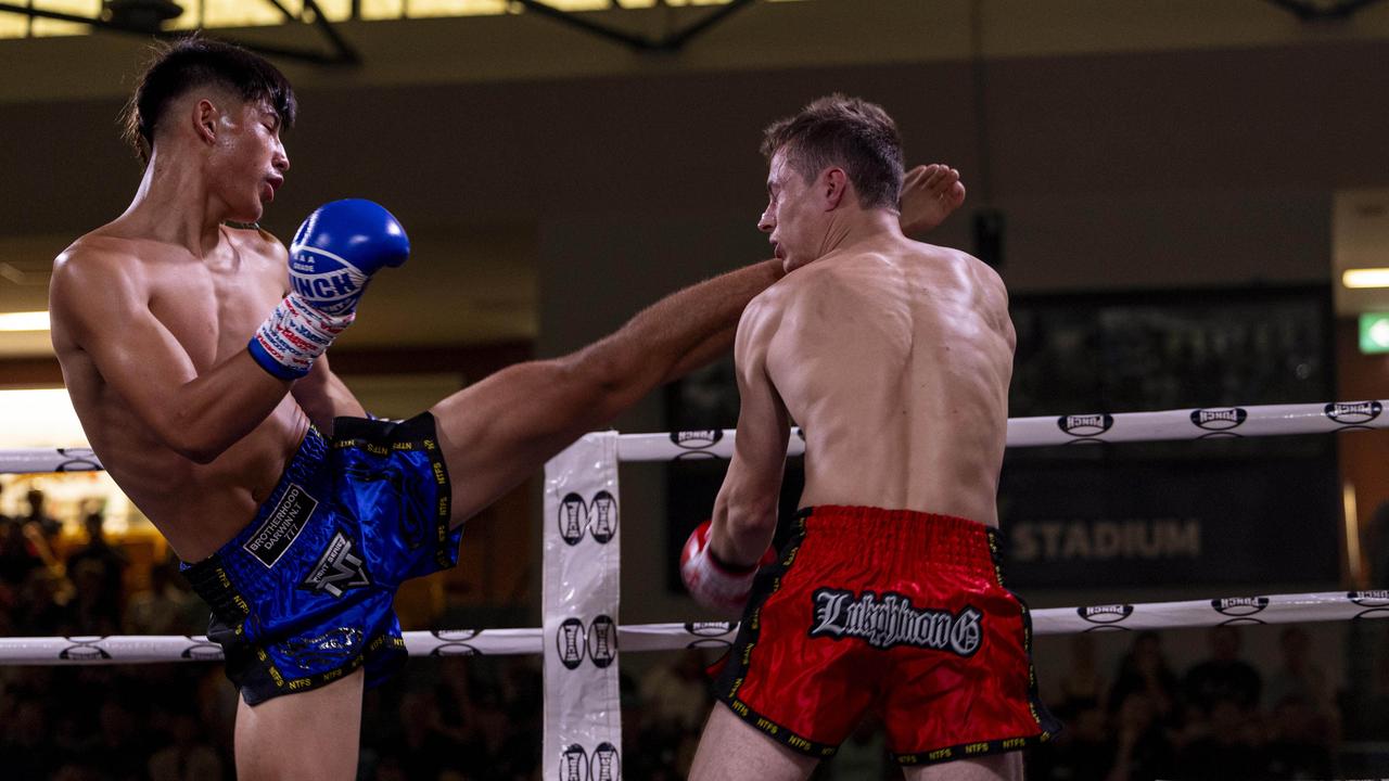 Jaiden Bartley (blue) vs. Ivor Peeters (red) at the NT Fight Series XI at Ventia Stadium. Picture: Pema Tamang Pakhrin