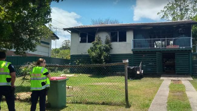 Police outside a house in Jacaranda Ave.